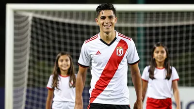 A photorealistic image of a young, athletic, and smiling Piojo Alvarado, wearing a white jersey with a red stripe, and a...